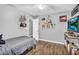 Bedroom with wood floors and a ceiling fan at 32881 N Hidden Canyon Dr, San Tan Valley, AZ 85144