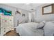 Bright bedroom featuring wood-look floors and ample natural light at 32881 N Hidden Canyon Dr, San Tan Valley, AZ 85144
