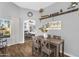 Cozy dining area with a wooden table and chairs, complemented by decorative accents and ample light at 32881 N Hidden Canyon Dr, San Tan Valley, AZ 85144
