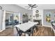 Open dining area with fireplace and outdoor access, perfect for entertaining or relaxing at 32881 N Hidden Canyon Dr, San Tan Valley, AZ 85144