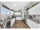 Modern kitchen with stainless steel appliances, granite countertops, and ample cabinet space at 32881 N Hidden Canyon Dr, San Tan Valley, AZ 85144