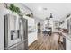 Open-concept kitchen, dining, and living area with abundant natural light at 32881 N Hidden Canyon Dr, San Tan Valley, AZ 85144