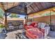 Covered outdoor patio with lounge seating at 32881 N Hidden Canyon Dr, San Tan Valley, AZ 85144