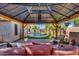 Inviting outdoor patio with gazebo and comfortable seating area overlooking the pool at 32881 N Hidden Canyon Dr, San Tan Valley, AZ 85144