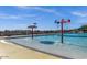 Community pool with fun water features and plenty of room to splash and play in the sun at 32881 N Hidden Canyon Dr, San Tan Valley, AZ 85144
