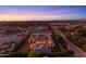 Gorgeous home featuring a sparkling pool, lush landscaping, and mountain views at 3981 E Runaway Bay Pl, Queen Creek, AZ 85142