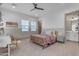 This cozy bedroom features neutral walls, a whimsical bedframe, and ample natural light from the windows at 3981 E Runaway Bay Pl, Queen Creek, AZ 85142