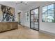 Bright foyer with wood floors, large windows, natural light and views to the courtyard at 3981 E Runaway Bay Pl, Queen Creek, AZ 85142