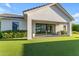 This home features a covered patio and expansive sliding glass doors for indoor/outdoor living at 3981 E Runaway Bay Pl, Queen Creek, AZ 85142