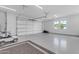 Bright and clean garage with epoxy floors, ample space and natural light from a side window at 3981 E Runaway Bay Pl, Queen Creek, AZ 85142