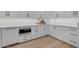 Stylish kitchen with white cabinets and countertops, featuring modern stainless steel appliances at 3981 E Runaway Bay Pl, Queen Creek, AZ 85142