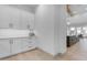 Charming kitchen with white cabinets, sleek countertops, and wood floors at 3981 E Runaway Bay Pl, Queen Creek, AZ 85142