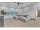 An open-concept living room featuring plenty of natural light and comfortable seating at 3981 E Runaway Bay Pl, Queen Creek, AZ 85142