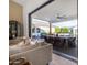 Living room with sliding glass doors to an outdoor patio and pool at 3981 E Runaway Bay Pl, Queen Creek, AZ 85142