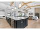 Spacious living area with a kitchen island and vaulted ceilings at 3981 E Runaway Bay Pl, Queen Creek, AZ 85142