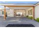 An expansive covered patio offers seamless indoor-outdoor living with elegant lighting at 3981 E Runaway Bay Pl, Queen Creek, AZ 85142