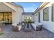 This outdoor patio features modern seating around a central fire pit, perfect for outdoor living at 3981 E Runaway Bay Pl, Queen Creek, AZ 85142