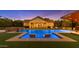 Relaxing backyard pool with in-water loungers, sun deck, and views of the lushly landscaped yard at 3981 E Runaway Bay Pl, Queen Creek, AZ 85142