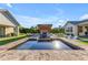 A luxurious pool with a water feature and an outdoor kitchen for ultimate relaxation and entertainment at 3981 E Runaway Bay Pl, Queen Creek, AZ 85142