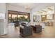 Expansive living room with high ceilings, a fireplace, and seamless access to the outdoor pool area at 6633 E Horseshoe Rd, Paradise Valley, AZ 85253