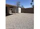 Low maintenance backyard with gravel, block fence and shed at 12836 N 39Th Ln, Phoenix, AZ 85029