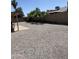 Low maintenance backyard with gravel, covered patio and block fence at 12836 N 39Th Ln, Phoenix, AZ 85029
