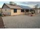 The backyard features a covered patio area, solar panels, and gravel ground cover at 12836 N 39Th Ln, Phoenix, AZ 85029