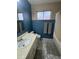 Cozy bathroom with a tiled floor, neutral walls, and combination tub and shower at 12836 N 39Th Ln, Phoenix, AZ 85029