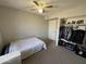 Bedroom with a ceiling fan, carpeted floor, and closet at 12836 N 39Th Ln, Phoenix, AZ 85029