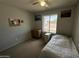 This bedroom has a window, carpeted floors, and is filled with natural light at 12836 N 39Th Ln, Phoenix, AZ 85029