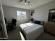 Bedroom with a window, carpeted floor, ceiling fan, and closet at 12836 N 39Th Ln, Phoenix, AZ 85029