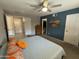 Comfortable bedroom with closet and en suite views, neutral carpet, ceiling fan, and colourful bed accents at 12836 N 39Th Ln, Phoenix, AZ 85029