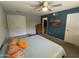 A cozy bedroom with ample closet space, a ceiling fan, and an en-suite bathroom at 12836 N 39Th Ln, Phoenix, AZ 85029