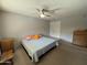 Inviting bedroom features a ceiling fan, dresser, and neutral color scheme creating a calming and comfortable retreat at 12836 N 39Th Ln, Phoenix, AZ 85029