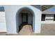 Covered arched entryway of a home with drought-resistant landscaping at 12836 N 39Th Ln, Phoenix, AZ 85029