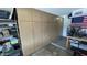 Organized garage with built-in cabinetry, work table, and tidy shelves providing ample storage space and functionality at 12836 N 39Th Ln, Phoenix, AZ 85029
