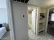 View of a hallway showing a bathroom with a shower and a bedroom at 12836 N 39Th Ln, Phoenix, AZ 85029