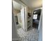 View of a hallway showing a bathroom with a shower and a bedroom at 12836 N 39Th Ln, Phoenix, AZ 85029