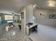 Open floor plan with tile floors connects the living room and kitchen at 12836 N 39Th Ln, Phoenix, AZ 85029