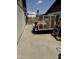 A side yard featuring a trailer with a metal cage, a ladder, and block wall at 12836 N 39Th Ln, Phoenix, AZ 85029