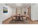 Elegant dining room with a classic wooden table, seating for six, and a decorative rug at 2022 N 124Th Dr, Avondale, AZ 85392