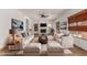 Spacious living room with a fireplace, vaulted ceiling, and neutral color palette at 2022 N 124Th Dr, Avondale, AZ 85392