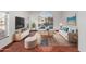 Bright living room with a large arched window, plush seating, and modern decor at 2022 N 124Th Dr, Avondale, AZ 85392