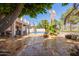 Spacious backyard featuring a pool, patio, and desert landscaping, perfect for outdoor living at 21483 N 65Th Ave, Glendale, AZ 85308