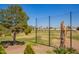 Backyard view with mature tree and golf course view at 21483 N 65Th Ave, Glendale, AZ 85308