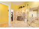 Luxurious bathroom featuring marble, unique decor, and a glass enclosed shower for a spa-like experience at 21483 N 65Th Ave, Glendale, AZ 85308
