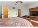 Bright bedroom featuring light green walls, and two closets at 21483 N 65Th Ave, Glendale, AZ 85308