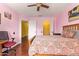 Bright bedroom featuring light pink walls and two closets at 21483 N 65Th Ave, Glendale, AZ 85308