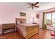 Cozy bedroom with ceiling fan, natural light, and wood-style floors at 21483 N 65Th Ave, Glendale, AZ 85308