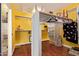 Well-organized closet with ample storage space, wood flooring, and built-in shelves for optimal functionality at 21483 N 65Th Ave, Glendale, AZ 85308